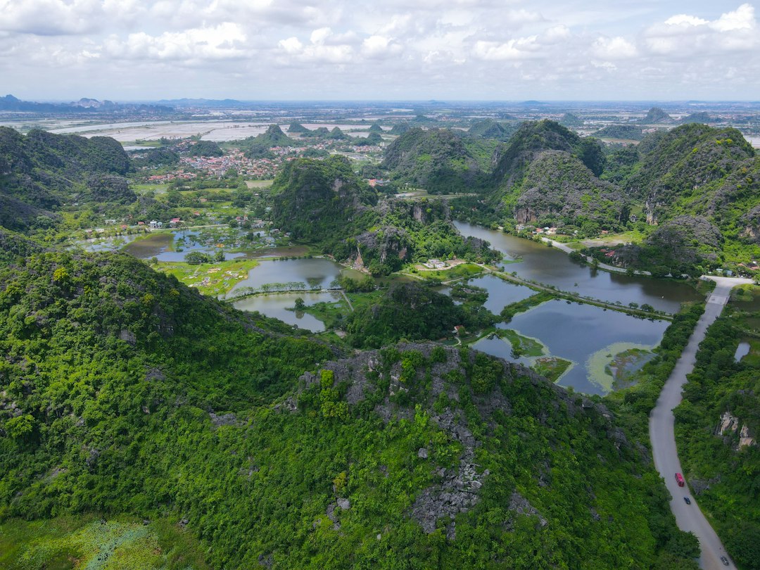 Vietnamese rice paddies beneath limestone mountains